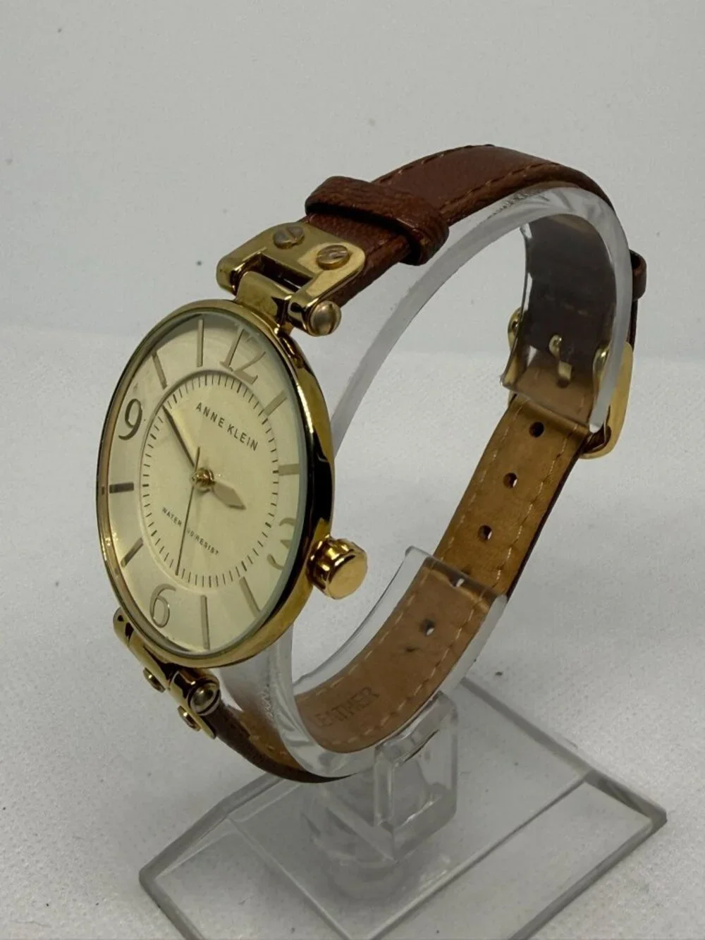 Anne Klein Ladies Gold-Tone Round Watch Cream Dial Roman Numeral Leather 10-9168